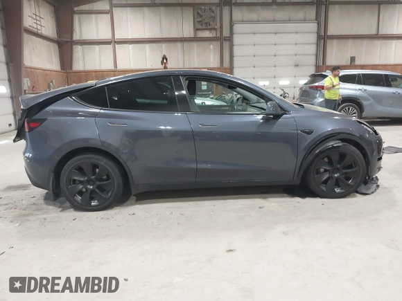 2023 Tesla Model Y Long Range with VIN 7SAYGAEE2PF755674, listed as a IAAI auction lot 41890025 with 24,783 mi miles and . Bid and sale history available at DreamBid. Image 13.
