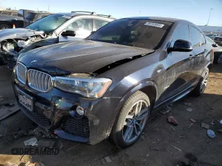 2015 BMW X4 xDrive35i with VIN 5UXXW5C56F0E87474, listed as a Copart auction lot 39752004 with 116,806 mi miles. Bid and sale history available at carsss.com. Image 1.