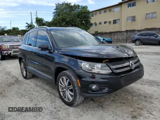 2014 Volkswagen Tiguan SE with VIN WVGAV3AXXEW543245, listed as a Copart auction lot 42288905 with 92,851 mi miles and Salvage title. Bid and sale history available at DreamBid. Image 4.