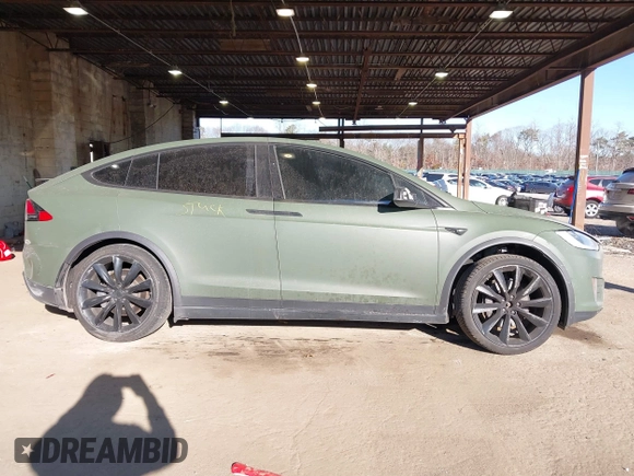 2020 Tesla Model X Long Range with VIN 5YJXCDE24LF272242, listed as a IAAI auction lot 41275226 with 103,731 mi miles. Bid and sale history available at carsss.com. Image 13.