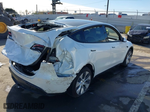 2021 Tesla Model Y Standard Range z VIN 5YJYGDED4MF162982, wystawiony jako IAAI lot #41378674 z przebiegiem 60 267 mil mil oraz . Historia ofert i sprzedaży dostępna na DreamBid. Obrazek 4.