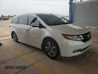 2017 Honda Odyssey Touring with VIN 5FNRL5H94HB007979, listed as a Copart auction lot 56755435 with 125,821 mi miles and Salvage title. Bid and sale history available at DreamBid. Image 4.