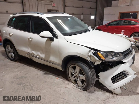 2011 Volkswagen Touareg Sport with VIN WVGFF9BP8BD004747, listed as a IAAI auction lot 41780515 with 159,228 mi miles and . Bid and sale history available at DreamBid. Image 1.