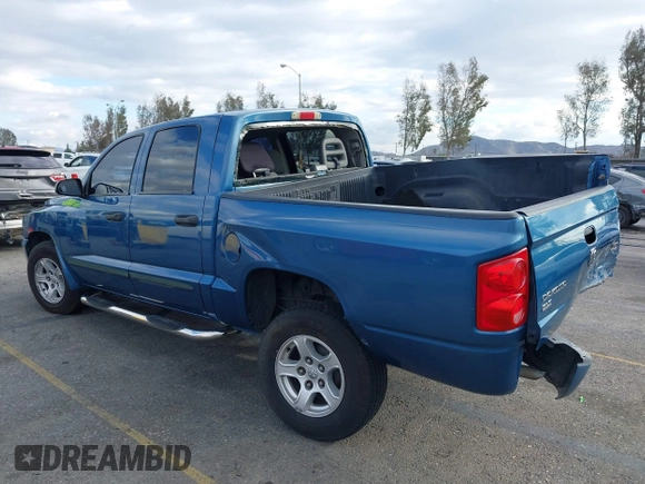 2005 Dodge Dakota SLT with VIN 1D7HE48N85S261745, listed as a IAAI auction lot 41401763 with 153,799 mi miles and . Bid and sale history available at DreamBid. Image 3.