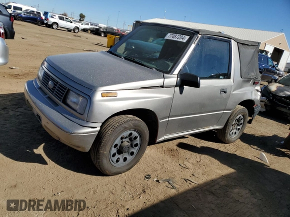 1995 Chevrolet Tracker z VIN 2CNBJ186XS6926688, wystawiony jako Copart lot #77487204 z przebiegiem 17 598 mil mil oraz Szkoda całkowita • Salvage title. Historia ofert i sprzedaży dostępna na DreamBid. Obrazek 1.