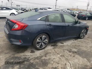 2018 Honda Civic EX-T z VIN JHMFC1F32JX006088, wystawiony jako Copart lot #50563105 z przebiegiem 117 744 mil mil oraz Szkoda całkowita • Salvage title. Historia ofert i sprzedaży dostępna na DreamBid. Obrazek 3.