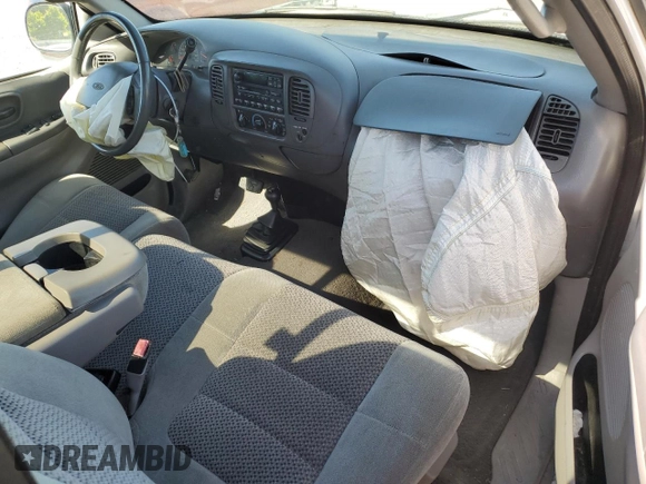 2001 Ford F-150 XL with VIN 1FTRF18L41NB60977, listed as a Copart auction lot 54933785 with 238,700 mi miles and Salvage title. Bid and sale history available at DreamBid. Image 8.