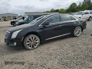2013 Cadillac XTS Premium z VIN 2G61S5S3XD9119501, wystawiony jako Copart lot #53844845 z przebiegiem 129 177 mil mil oraz Tytuł czysty. Historia ofert i sprzedaży dostępna na DreamBid. Obrazek 1.