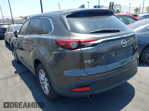 2017 Mazda CX-9 Touring with VIN JM3TCBCY1H0131233, listed as a IAAI auction lot 42490137 with 84,216 mi miles and . Bid and sale history available at DreamBid. Image 3.