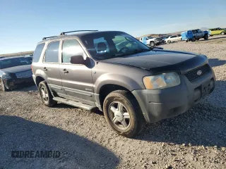 2002 Ford Escape XLS Choice with VIN 1FMYU021X2KC77142, listed as a Copart auction lot 77036384 with 213,292 mi miles and Clean title. Bid and sale history available at DreamBid. Image 4.