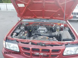 2001 Isuzu Rodeo S z VIN 4S2CK58W414308980, wystawiony jako IAAI lot #42496432 z przebiegiem 166 360 mil mil oraz . Historia ofert i sprzedaży dostępna na DreamBid. Obrazek 10.