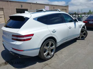2023 Genesis GV80 with VIN KMUHBDSB8PU102875, listed as a IAAI auction lot 42370874 with 30,318 mi miles and . Bid and sale history available at DreamBid. Image 4.