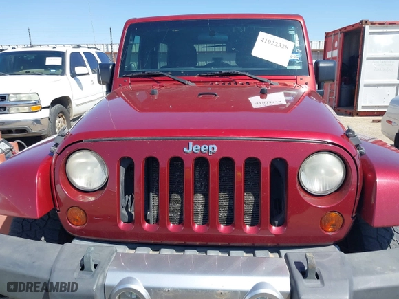 2011 Jeep Wrangler Unlimited Sahara with VIN 1J4BA5H15BL557871, listed as a IAAI auction lot 41922328 with 206,581 mi miles. Bid and sale history available at carsss.com. Image 6.