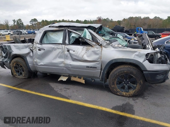 2021 Ram 1500 Rebel with VIN 1C6SRFLT0MN734774, listed as a IAAI auction lot 41075676 with 95,808 mi miles and . Bid and sale history available at DreamBid. Image 6.