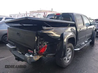 2010 GMC Canyon z VIN 1GTJSFDP6A8134412, wystawiony jako IAAI lot #41589150 z przebiegiem 164 232 mil mil oraz . Historia ofert i sprzedaży dostępna na DreamBid. Obrazek 4.