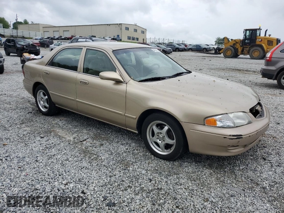 2001 Mazda 626 LX z VIN 1YVGF22C715202574, wystawiony jako Copart lot #54132915 z przebiegiem 237 041 mil mil oraz Szkoda całkowita • Salvage title. Historia ofert i sprzedaży dostępna na DreamBid. Obrazek 4.