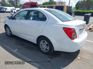 2014 Chevrolet Sonic LT with VIN 1G1JC5SH0E4232070, listed as a IAAI auction lot 41970353 with 140,557 mi miles and . Bid and sale history available at DreamBid. Image 3.