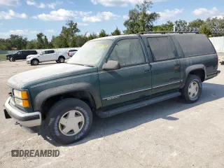 1998 GMC Suburban z VIN 3GKFK16R1WG511256, wystawiony jako Copart lot #77568484 z przebiegiem 301 116 mil mil oraz Tytuł czysty. Historia ofert i sprzedaży dostępna na DreamBid. Obrazek 1.
