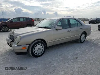 1999 Mercedes-Benz E-Class with VIN WDBJF82H9XX022535, listed as a Copart auction lot 86554534 with 140,904 mi miles and Salvage Title. Bid and sale history available at carsss.com. Image 1.