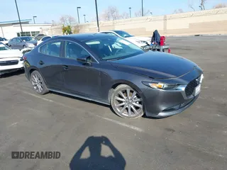 2019 Mazda 3 w/Select Pkg with VIN 3MZBPAAL1KM105498, listed as a IAAI auction lot 41601386 with 113,203 mi miles. Bid and sale history available at carsss.com. Image 1.