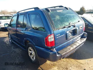 2004 Isuzu Rodeo S with VIN 4S2CK58W444314265, listed as a IAAI auction lot 41294636 with 291,080 mi miles and . Bid and sale history available at DreamBid. Image 3.