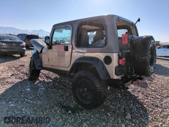 2004 Jeep Wrangler Rubicon with VIN 1J4FA69S14P749749, listed as a Copart auction lot 44458485 with 99,121 mi miles and Salvage Title. Bid and sale history available at carsss.com. Image 2.