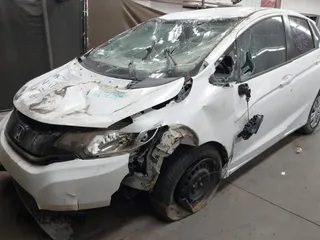 2016 Honda Fit LX with VIN JHMGK5H5XGX021847, listed as a IAAI auction lot 41651588 with 18,140 mi miles. Bid and sale history available at carsss.com. Image 6.