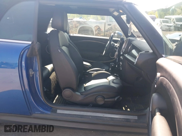 2013 MINI Convertible S with VIN WMWZP3C5XDT705613, listed as a IAAI auction lot 42392748 with 87,477 mi miles and . Bid and sale history available at DreamBid. Image 5.