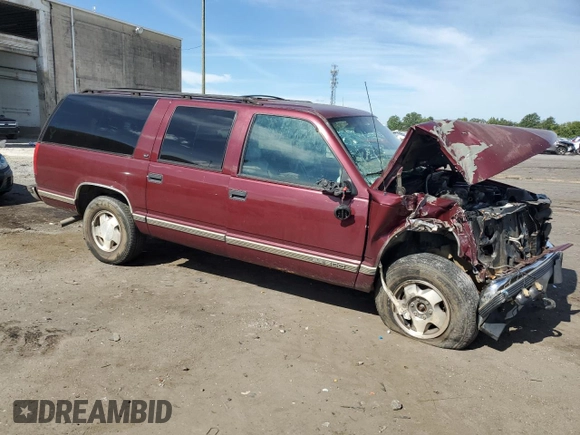 1998 GMC Suburban z VIN 3GKFK16R1WG503206, wystawiony jako Copart lot #69802344 z przebiegiem 231 148 mil mil oraz Szkody całkowita. Historia ofert i sprzedaży dostępna na DreamBid. Obrazek 4.