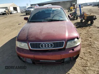 2000 Audi S4 z VIN WAUDD68DXYA127728, wystawiony jako Copart lot #75094394 z przebiegiem 164 612 mil mil oraz Szkody całkowita. Historia ofert i sprzedaży dostępna na DreamBid. Obrazek 5.