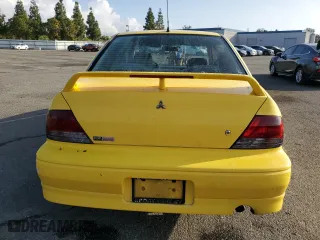 2002 Mitsubishi Lancer OZ-Rally with VIN JA3AJ86E82U071265, listed as a Copart auction lot 77711904 with 174,088 mi miles and Salvage Title. Bid and sale history available at carsss.com. Image 6.