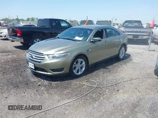 2013 Ford Taurus SEL with VIN 1FAHP2E88DG105557, listed as a IAAI auction lot 42040773 with 157,705 mi miles and . Bid and sale history available at carsss.com. Image 2.