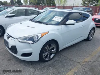 2015 Hyundai Veloster with VIN KMHTC6AD5FU231224, listed as a IAAI auction lot 41944186 with 103,124 mi miles. Bid and sale history available at carsss.com. Image 2.