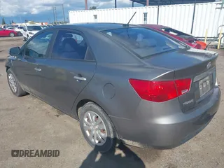 2010 Kia Forte EX with VIN KNAFU4A28A5229372, listed as a IAAI auction lot 41911118 with 166,084 mi miles. Bid and sale history available at carsss.com. Image 3.