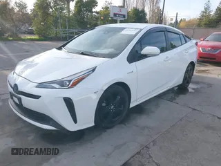 2021 Toyota Prius L Eco z VIN JTDKAMFU9M3131228, wystawiony jako IAAI lot #41257117 z przebiegiem 72 840 mil mil oraz . Historia ofert i sprzedaży dostępna na DreamBid. Obrazek 18.