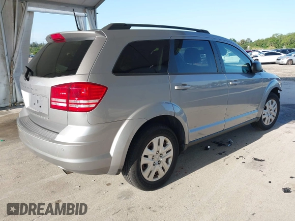 2020 Dodge Journey SE Value with VIN 3C4PDCAB7LT261203, listed as a IAAI auction lot 41963451 with 69,612 mi miles and . Bid and sale history available at carsss.com. Image 4.
