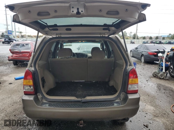 2002 Mazda Tribute LX with VIN 4F2YU09132KM24637, listed as a Copart auction lot 88919855 with 211,198 mi miles and Salvage Title. Bid and sale history available at carsss.com. Image 6.