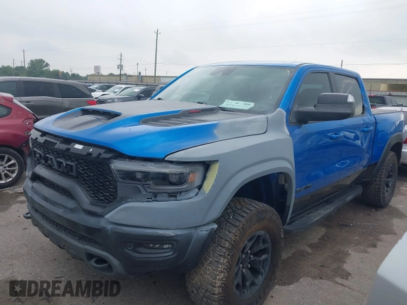 2021 Ram 1500 TRX with VIN 1C6SRFU91MN790158, listed as a IAAI auction lot 42115253 with 30,969 mi miles and . Bid and sale history available at DreamBid. Image 2.