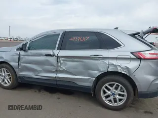 2022 Ford Edge SEL z VIN 2FMPK4J93NBA94793, wystawiony jako IAAI lot #41884687 z przebiegiem 57 372 mil mil oraz . Historia ofert i sprzedaży dostępna na DreamBid. Obrazek 6.