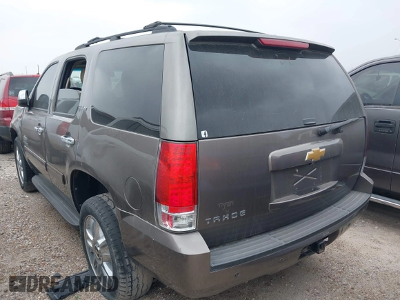 2014 Chevrolet Tahoe LT with VIN 1GNSCBE08ER106419, listed as a IAAI auction lot 41789896 with 99,420 mi miles and . Bid and sale history available at DreamBid. Image 3.