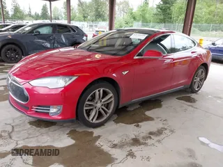 2013 Tesla Model S with VIN 5YJSA1CN7DFP26996, listed as a IAAI auction lot 42244540 with 128,160 mi miles and . Bid and sale history available at DreamBid. Image 2.