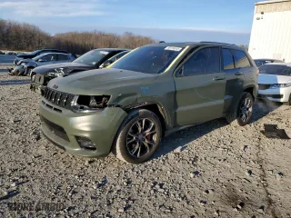 2021 Jeep Grand Cherokee SRT with VIN 1C4RJFDJ5MC718125, listed as a Copart auction lot 88736945 with 54,553 mi miles and Salvage Title. Bid and sale history available at carsss.com. Image 1.