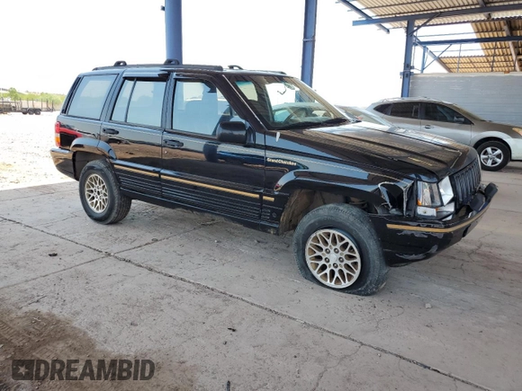 1994 Jeep Grand Cherokee Limited with VIN 1J4GZ78S5RC304501, listed as a Copart auction lot 64632335 with 184,333 mi miles and Salvage title. Bid and sale history available at DreamBid. Image 4.