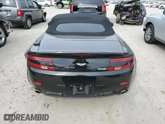 2009 Aston Martin Vantage z VIN SCFBF04CX9GD11942, wystawiony jako Copart lot #43771214 z przebiegiem 52 730 mil mil oraz . Historia ofert i sprzedaży dostępna na DreamBid. Obrazek 6.