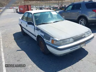 1990 Mazda 626 z VIN 1YVGD22B8L5242825, wystawiony jako IAAI lot #42520515 z przebiegiem 193 191 mil mil oraz . Historia ofert i sprzedaży dostępna na DreamBid. Obrazek 1.