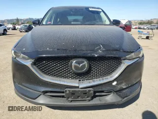 2018 Mazda CX-5 Grand Touring с VIN JM3KFADM2J1310339, выставлен на аукционе Copart как лот 64705245 с пробегом 63 927 миль миль и Списание • Salvage title. История ставок и продаж доступна на DreamBid. Изображение 5.