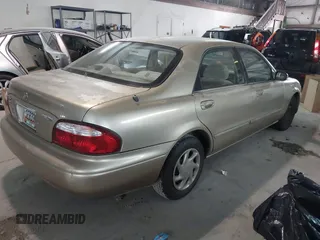 1999 Mazda 626 ES with VIN 1YVGF22C9X5823002, listed as a IAAI auction lot 41385617 with 149,127 mi miles. Bid and sale history available at carsss.com. Image 4.