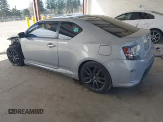 2014 Scion tC with VIN JTKJF5C71E3069593, listed as a IAAI auction lot 41901040 with 86,231 mi miles. Bid and sale history available at carsss.com. Image 3.