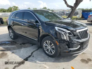 2022 Cadillac XT5 FWD Premium Luxury z VIN 1GYKNCRS7NZ101131, wystawiony jako Copart lot #56365065 z przebiegiem 74 168 mil mil oraz Szkoda całkowita • Salvage title. Historia ofert i sprzedaży dostępna na DreamBid. Obrazek 4.