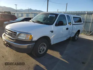 2000 Ford F-150 with VIN 1FTRX17W8YKB11043, listed as a Copart auction lot 77390664 with 181,439 mi miles and Salvage Title. Bid and sale history available at DreamBid. Image 1.